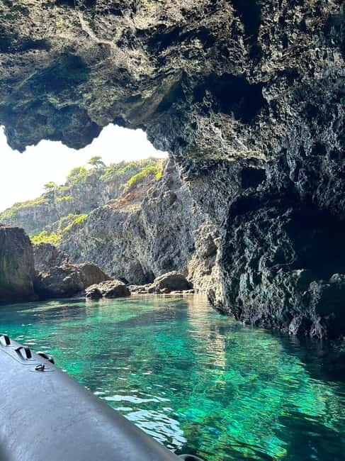 Boat Tour: Island hopping by dinghy with cave visits and snorkeling - Following the coast and its sea caves