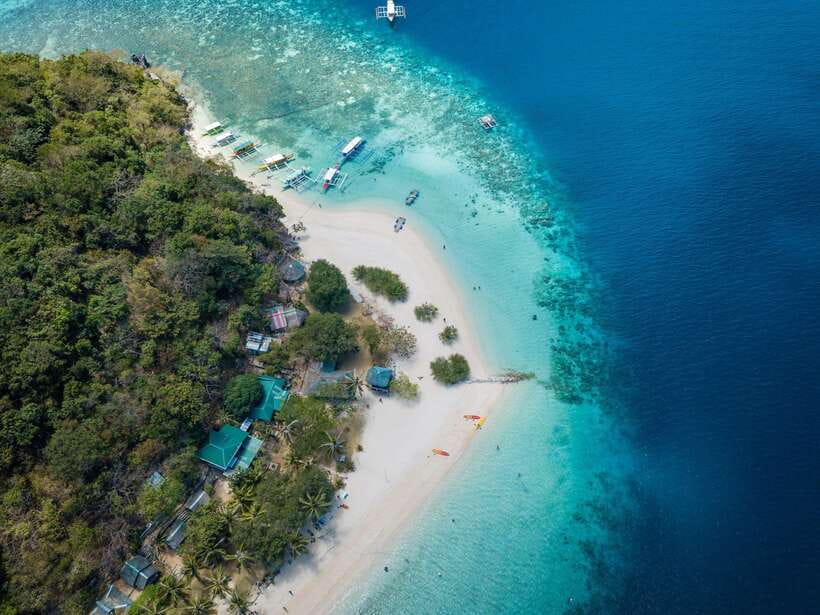 Coron: Coastal Cliffs, Beach & Malcapuya Island Hopping Tour - Three islands, one long day from Coron