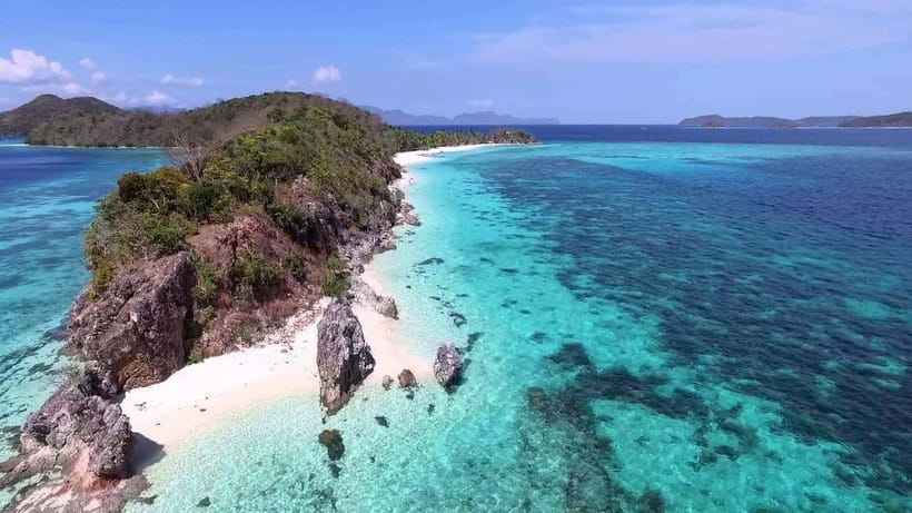 Coron: Coastal Cliffs, Beach & Malcapuya Island Hopping Tour - Banana Island: hammocks, sand, and a gentle first stop