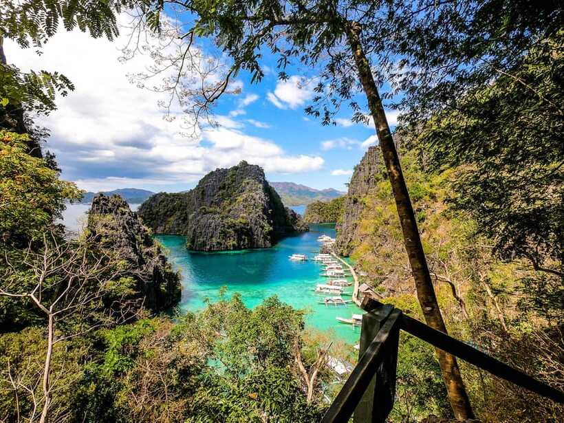 Coron Island Hopping: Super Ultimate Private Tour - Twin Lagoon rewards a short swim through the cliffs