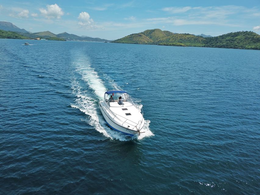 Coron: Private Island-Hopping Tour on a Yacht or Speedboat - Twin Lagoon between tall limestone walls