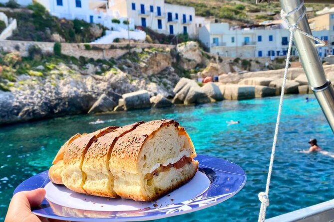 Egadi Islands Tour Favignana Levanzo by Boat with Lunch from Trapani - Bue Marino combines a cave and an aperitif
