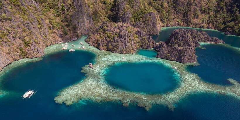 From Coron: Island Hopping Boat Day Trip with Buffet Lunch - Twin Lagoon and the rhythm of repeated swims
