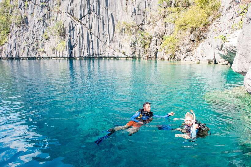 From Coron: Island Hopping Boat Day Trip with Buffet Lunch - A hot buffet lunch on the beach