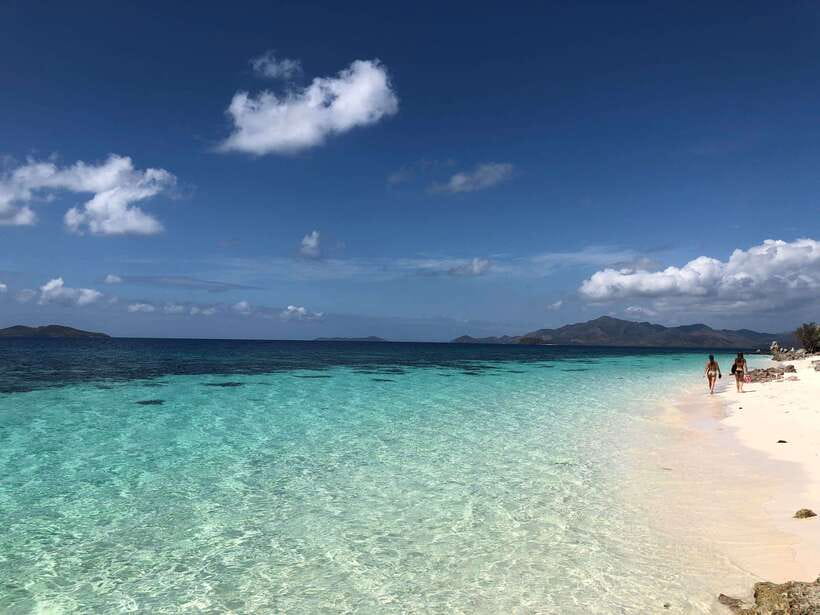 From Coron: Private Island-Hopping Cruise with Lunch - Banana Island’s curved beach and near-shore reef