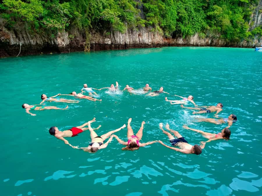 From Krabi: Phi Phi Early Bird & 4 Islands by Speedboat - Chicken Island and Poda Island finish the day