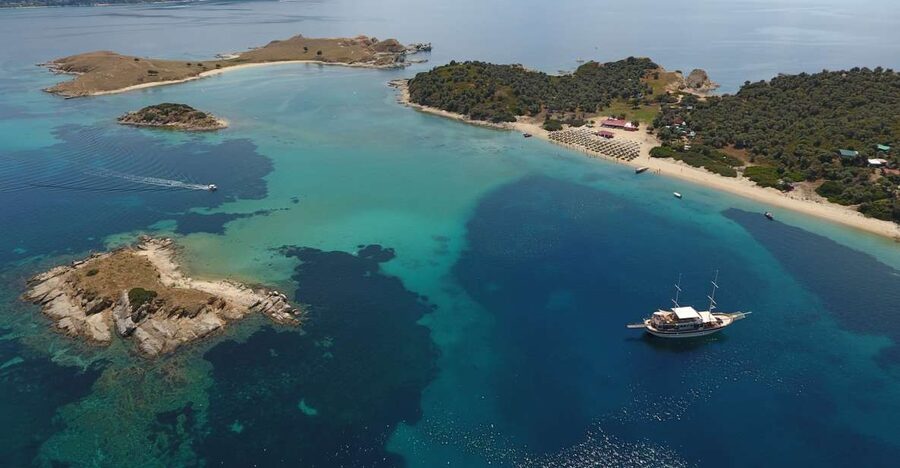 From Ouranoupoli: Blue Lagoon Two Island Cruise - Ammouliani Island brings a local market and village time