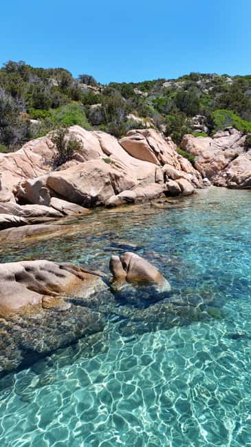 From San Teodoro: Tavolara Archipelago Dinghy Grand Tour - Tavolara’s cliffs and Cathedral Cave