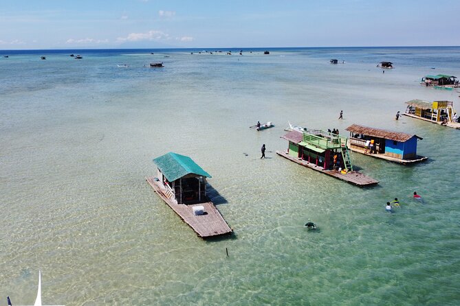 Island Hopping Experience: Snorkeling & Bamboo Cottages! - Boarding the floating bamboo cottage