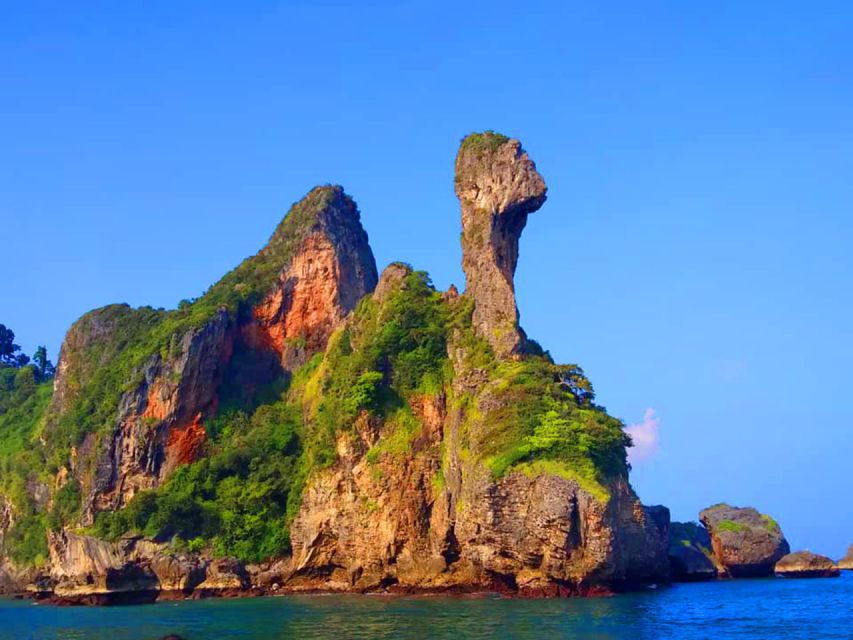 Krabi: 4 Islands Sunset Longtail Boat Tour with BBQ Dinner - Railay and Phra Nang: cliffs, caves, and the first swim