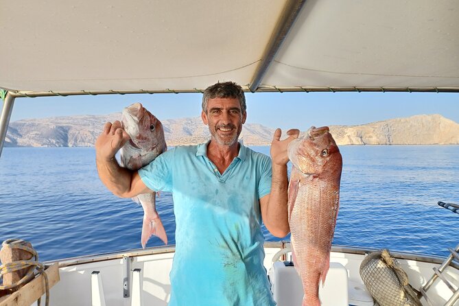 Naxos private fishing trips, lunch on board & island hopping - Cooking the catch on board