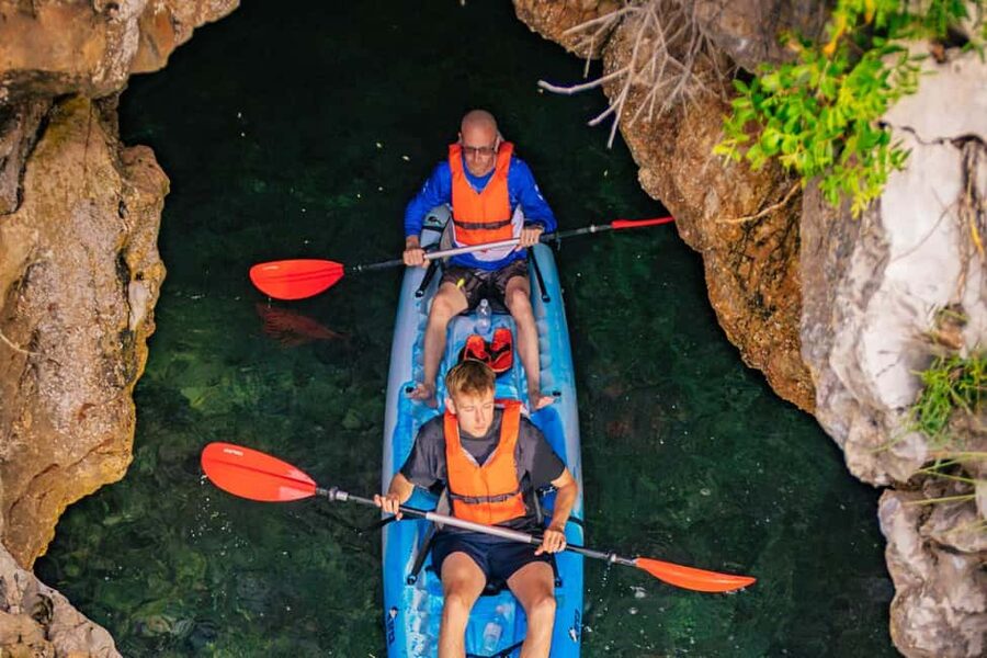 Pula: Three Island Kayak Tour with Cave Photo & Snorkeling - Paddling out from Pula